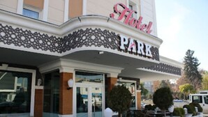 A hotel named "Hotel Park" with a classic architectural design, featuring a prominent entrance and outdoor seating area. - Park Otel (Kayseri)