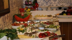 A buffet table with various dishes and utensils. - Park Otel (Kayseri)
