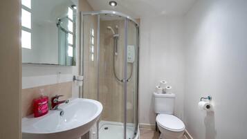 Shower, hair dryer, towels, toilet paper