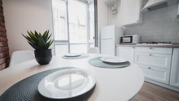 Basic Apartment | Private kitchen | Full-sized fridge, microwave, stovetop, electric kettle