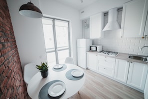 Basic Apartment | Private kitchen | Full-sized fridge, microwave, stovetop, electric kettle - Apart-hotel Kostjukowski Apartments (Lviv)