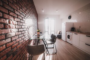 Family Apartment | Private kitchen | Full-sized fridge, microwave, stovetop, electric kettle - Apart-hotel Kostjukowski Apartments (Lviv)