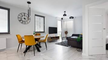 Deluxe Apartment | Living area | 40-inch flat-screen TV with digital channels, TV