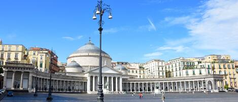 A large open square with a prominent dome and classical architecture.