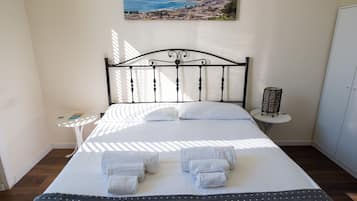 Grand Triple Room | Down comforters, desk, laptop workspace, soundproofing