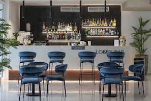 2 bars/lounges, poolside bar, beach bar