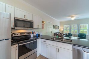 Fridge, microwave, oven, stovetop - Alpine River Suites #402 - Cozy Riverfront Condo (Helen)