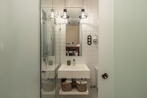 Shower, hair dryer, towels, soap