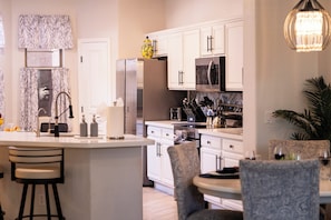 Coffee/tea maker, fridge, microwave, oven