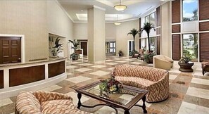 Relax in the stylish lobby with a comfortable seating area and large windows.