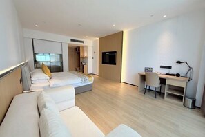 A modern hotel room with a bed, a desk, a chair, and a TV. - Sumahui Hotel (Suzhou East Railway Station Kechuang Center) (Suzhou)