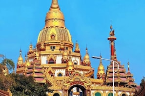A large, ornate temple with multiple spires and a prominent central dome. - Huang Jia Hotel Mangshi Square Mangshi Jewelry Town (Mangshi)