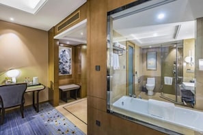 A modern hotel bathroom with a large glass-enclosed shower, a separate toilet, and a vanity area. - Shangqiu Xinhua Jianguo Hotel (Shangqiu)