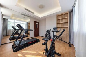 A gym with treadmills, stationary bikes, and weight machines. - Babala Hotel (Guangzhou Dagang) (Guangzhou)