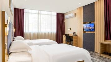 A hotel room with two beds, a desk, a TV, and a shoe rack.