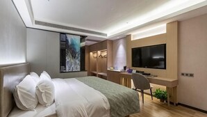 A modern hotel room with a bed, desk, TV, and a large window. - Gya Hotel (Nantong Nanshanhu Shuijie) (Nantong)