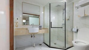 A modern bathroom with a glass-enclosed shower, a white sink, and a toilet. - City Youpin Hotel (Wuhan Zuoling New City) (Wuhan)
