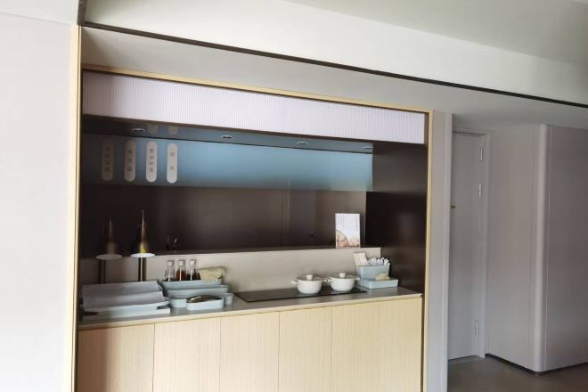 A modern kitchen with a built-in stove, a microwave, and a range hood.