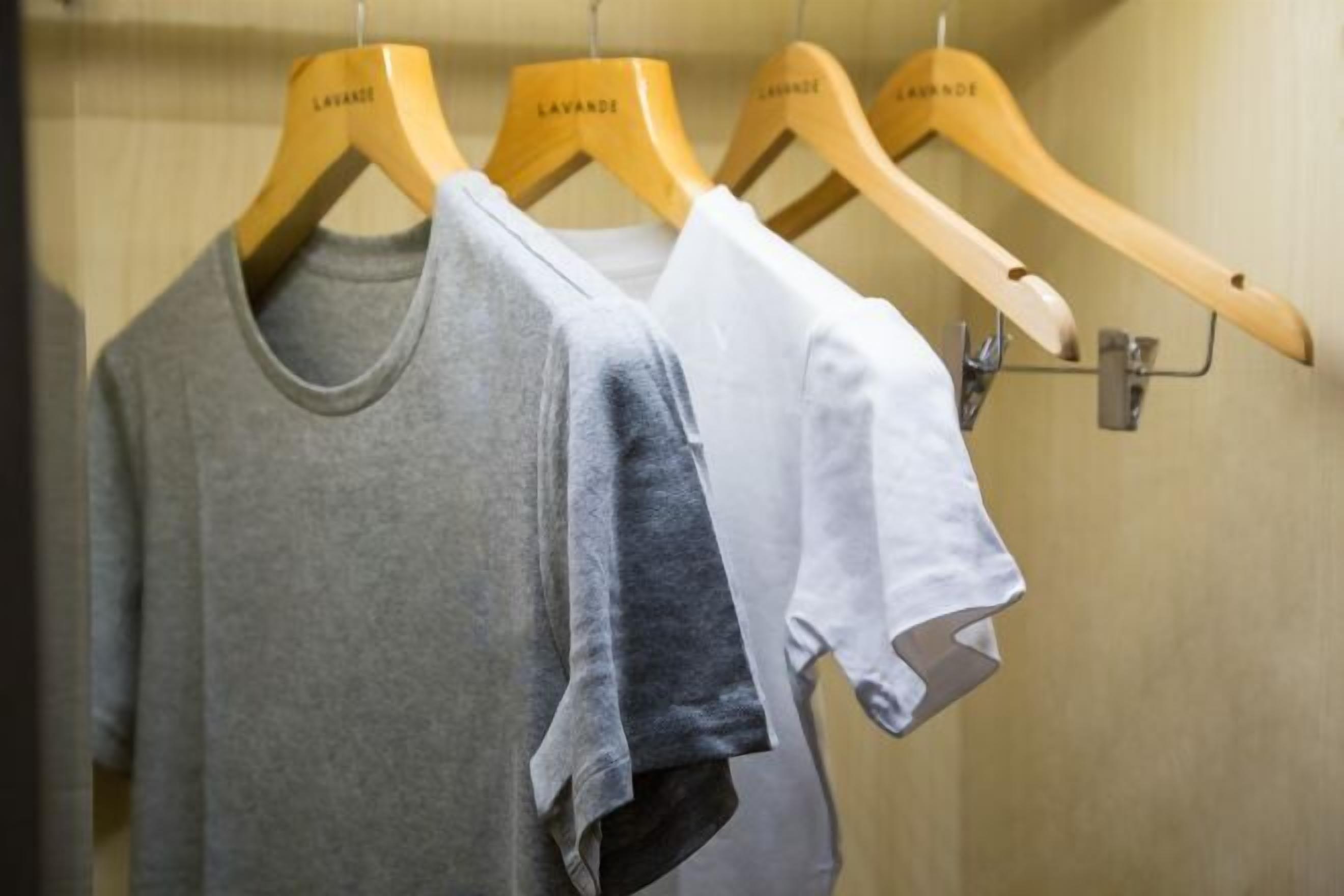 A clothing rack with three hangers, each labeled "LAVANDES."