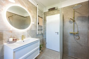 Bathtub, hair dryer, towels, soap