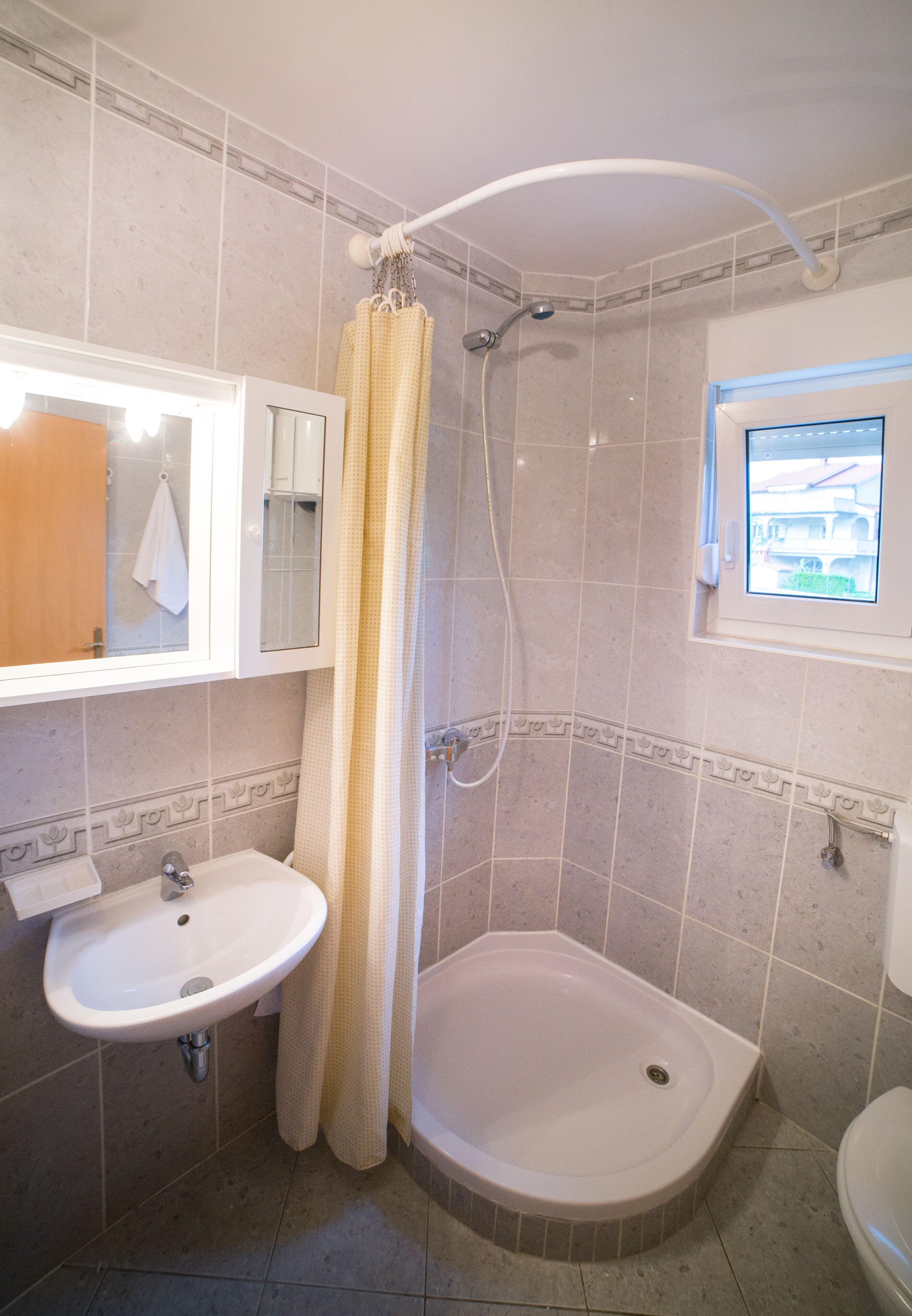 A bathroom with a sink, a bathtub, and a shower.