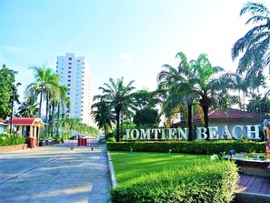 Enjoy leisure time at Jomten Beach, surrounded by palm trees and manicured lawns.