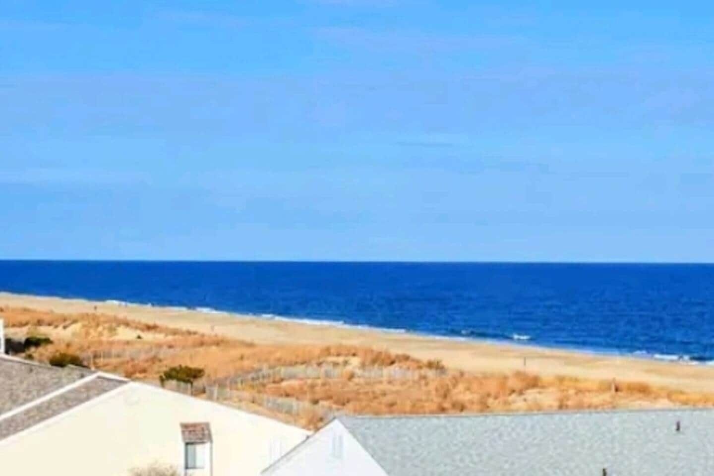 A coastal view with a beach and ocean.