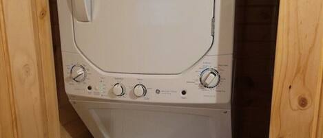 A compact washer and dryer unit with a control panel and an ENERGYGUIDE sticker.
