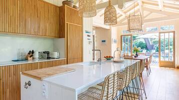 Fridge, dishwasher, coffee/tea maker, cookware/dishes/utensils