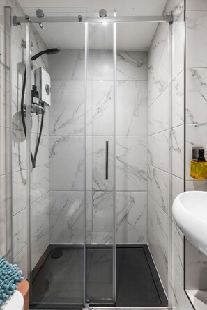 Shower, hair dryer, towels, soap