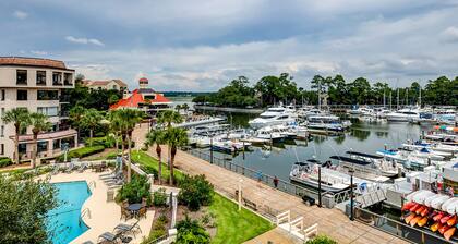 Yacht Club Villas | Updated corner condo with marina view, shared pool & hot tub