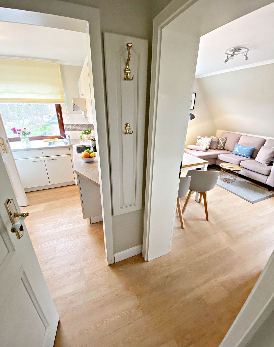A modern interior with a kitchen, dining area, and living room.