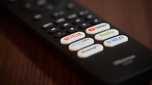 A remote control with buttons for Netflix, Hulu, and U-NEXT. - New Normal Hotel in MATSUYAMA (Naha)
