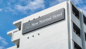 A building with a sign that reads "New Normal Hotel." - New Normal Hotel in MATSUYAMA (Naha)