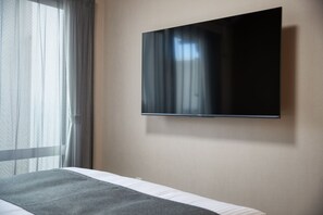 Standard Double Room, Non Smoking | Television - New Normal Hotel in MATSUYAMA (Naha)
