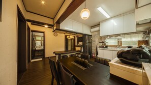 Enjoy cooking and dining in this well-equipped kitchen with a central island, appliances, and ample seating.