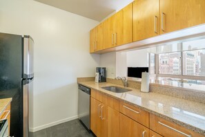 Fridge, microwave, oven, stovetop - Modern One Bedroom in Chelsea, Steps from the High (New York)