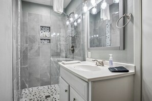 Combined shower/tub, hair dryer, towels, soap