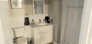 Combined shower/tub, hair dryer, towels, soap