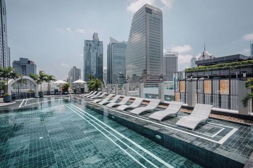 Outdoor pool, open 6:00 AM to 10:00 PM, pool umbrellas, pool loungers