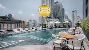 Outdoor pool, open 6:00 AM to 10:00 PM, pool umbrellas, pool loungers