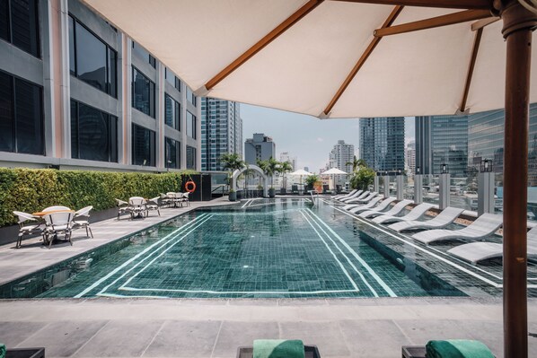 Outdoor pool, open 6:00 AM to 10:00 PM, pool umbrellas, pool loungers