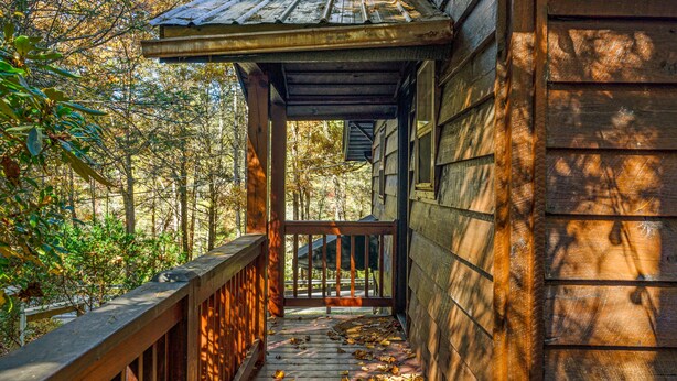 A wooden porch with a view of a forested area. - 🌲Easy Paved Access🔥Fireplace❤️Great Privacy🏞️Across River🎇NearDowntown🙂 (Blue Ridge)