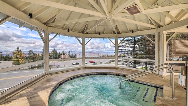 A hot tub with a view of a road and mountains. - Ski-In/Out Condo in Snowshoe Mountain Resort! (Snowshoe)
