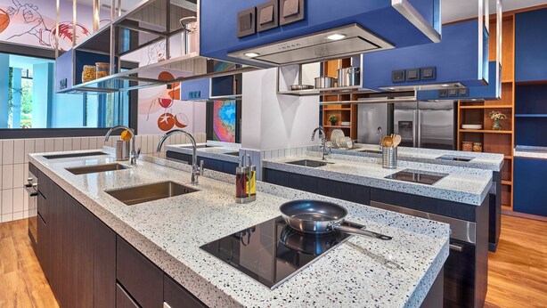 A modern kitchen with a central island, double sinks, and stainless steel appliances. - lyf Farrer Park Singapore (Singapore)