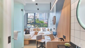 A modern bathroom with a sink, mirror, and toilet. - lyf Farrer Park Singapore (Singapore)