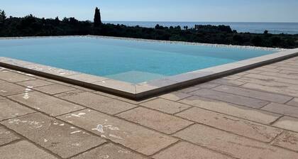 Blue door Trullo with sea view pool