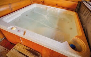 A hot tub with a control panel and a wooden interior. - Enchanted Forest - Seasonal Mountain Views, Community Pool & Hot Tub (Sevierville)