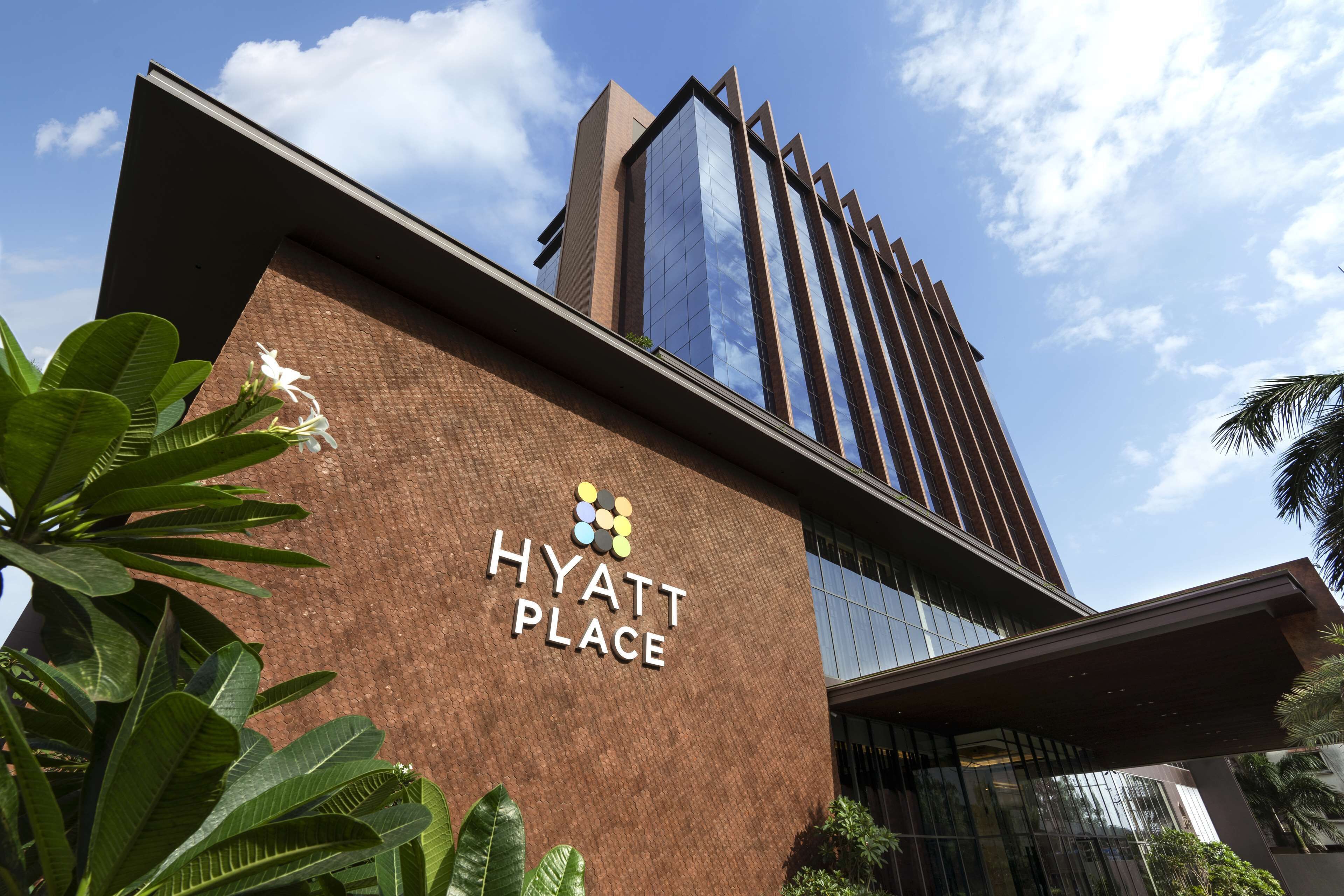 A modern building with a sign reading "Hyatt Place".