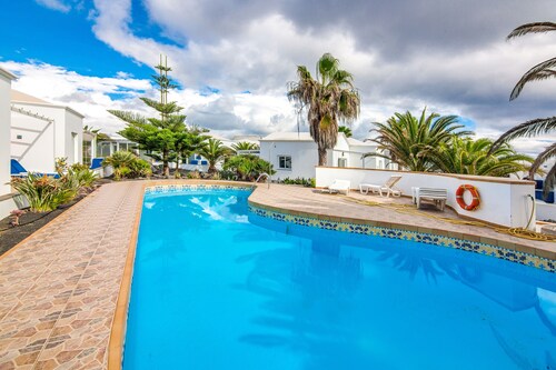 A3, in a small complex with communal heated pool 100m from the sea